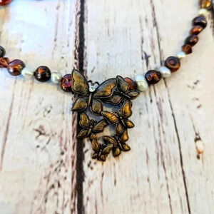 Vintage freshwater pearl and bead necklace, metal butterfly pendant, crystal